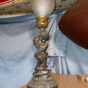 Brass cherub lamp.